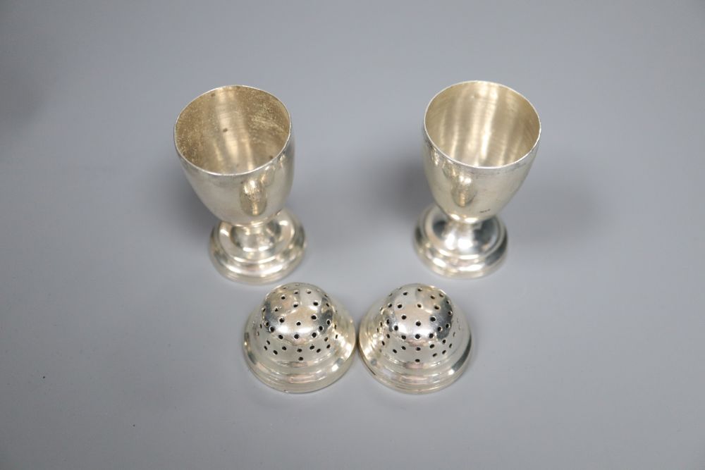 A Victorian silver cream jug, London, 1860, a later silver mustard, sauceboat and pair of pepperettes,